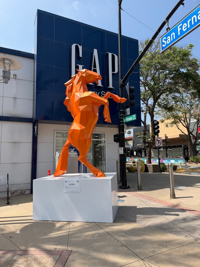 Richard Orlinski's orange horse sculpture on display in Downtown Burbank